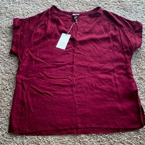 Burgundy shirt.
